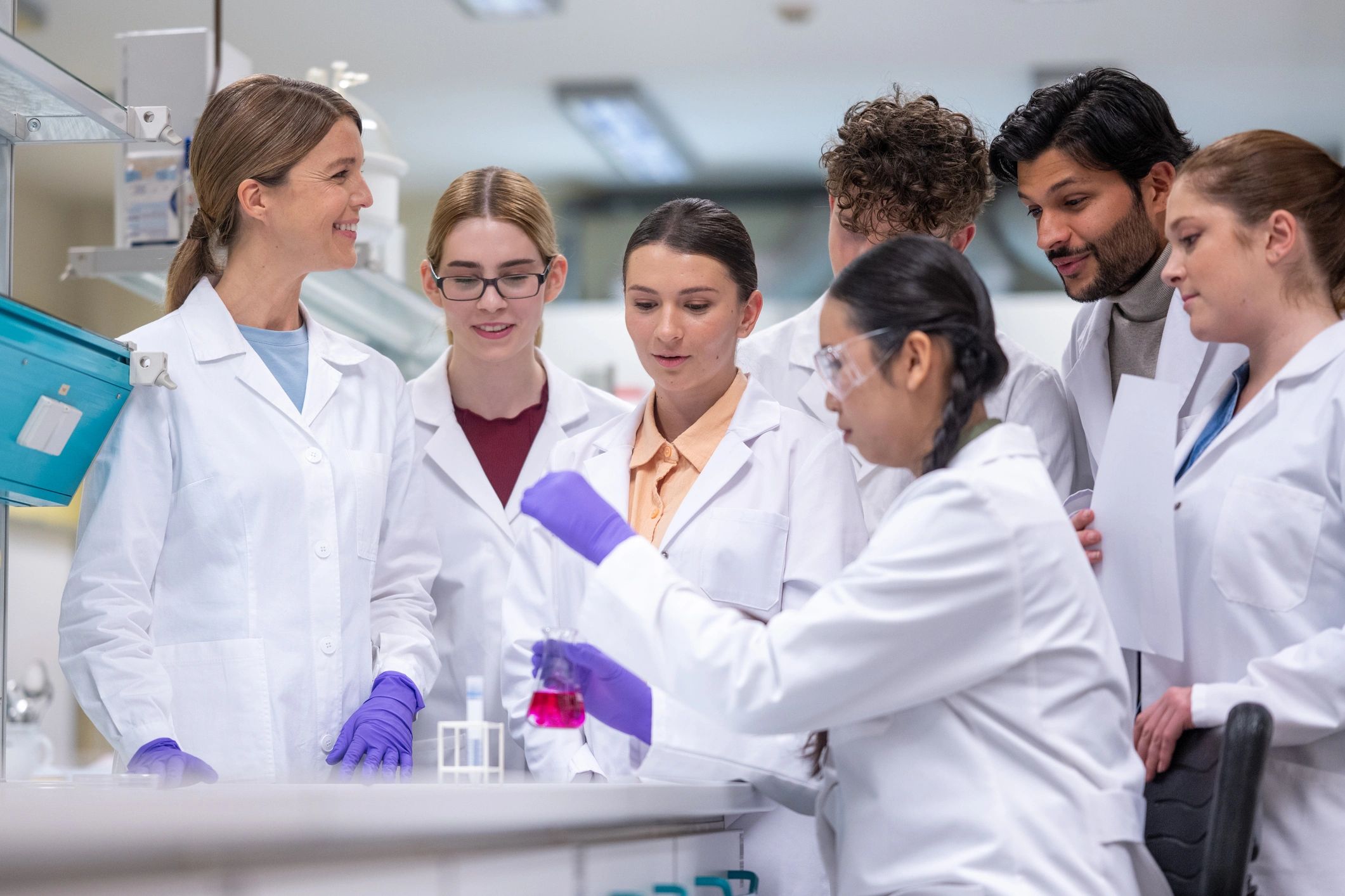 Collaborative research team working together in a modern laboratory